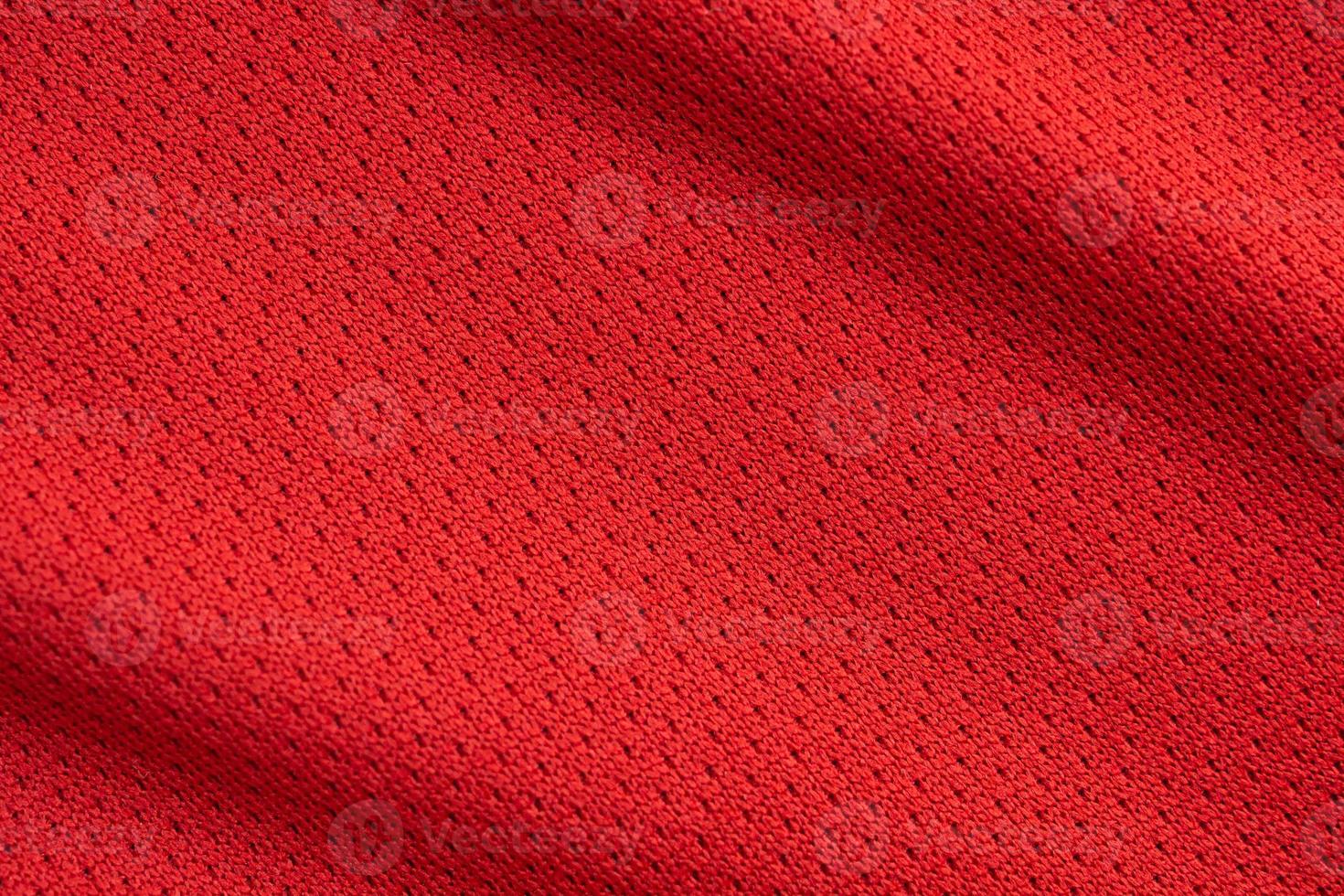 Red sports clothing fabric football jersey texture close up photo