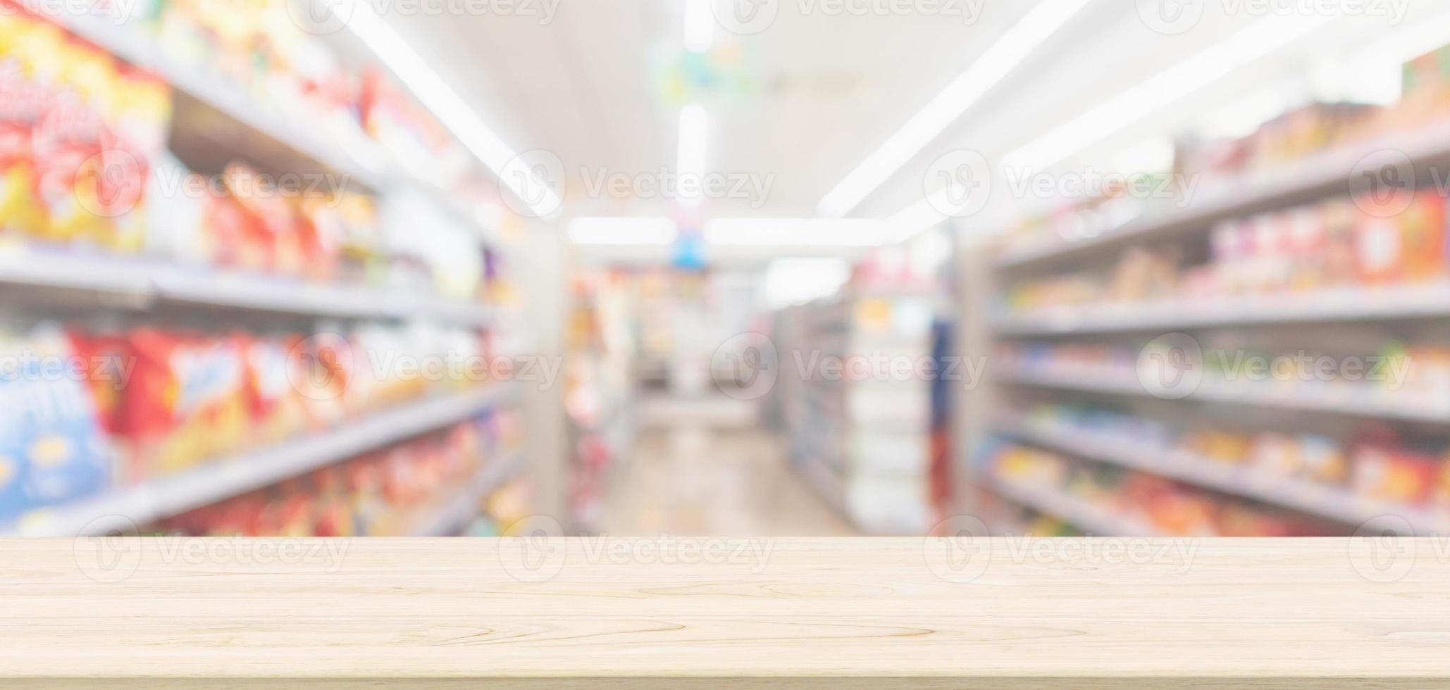 Empty Wood table top with supermarket grocery store blurred defocused background with bokeh light for montage product display photo