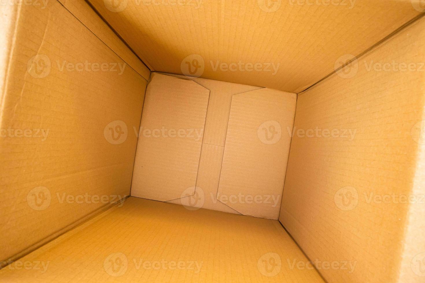 Open empty brown cardboard box background top view photo