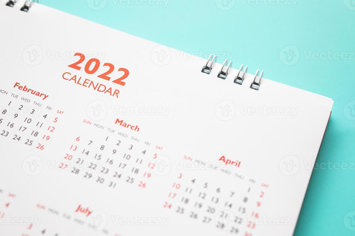 2022 calendar page on blue background business planning appointment meeting concept photo