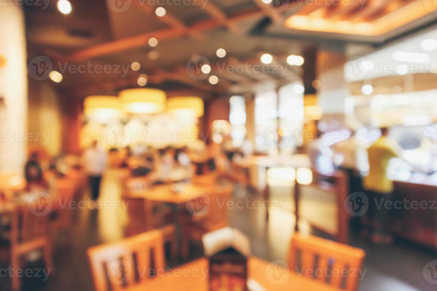 Restaurant interior with customer and wood table blur abstract background with bokeh light photo