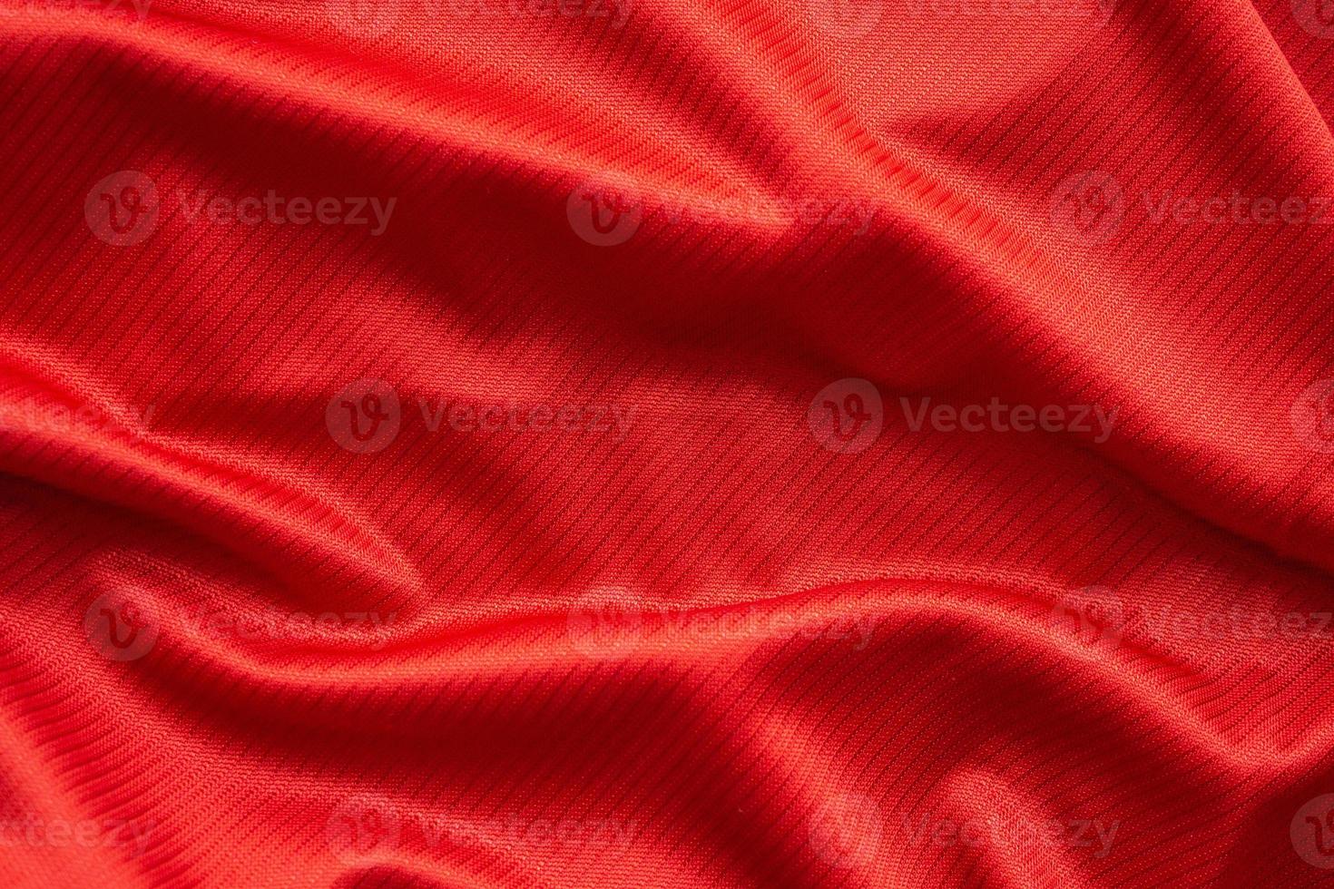 Red sports clothing fabric football jersey texture close up photo