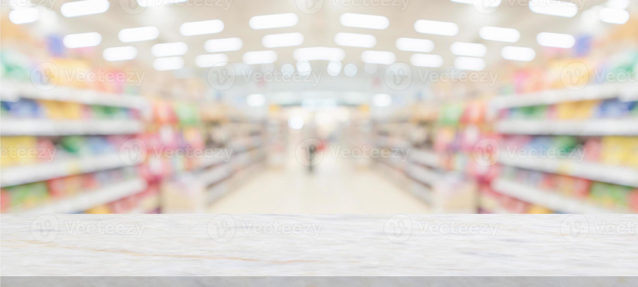 marble table top with supermarket grocery store blurred background with bokeh light for product display photo