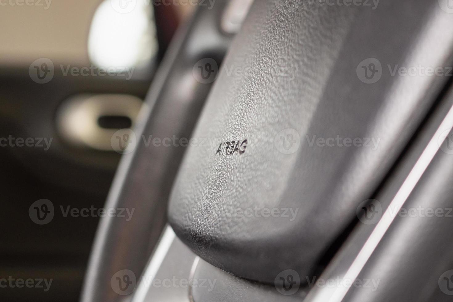 Safety airbag sign on car steering wheel photo