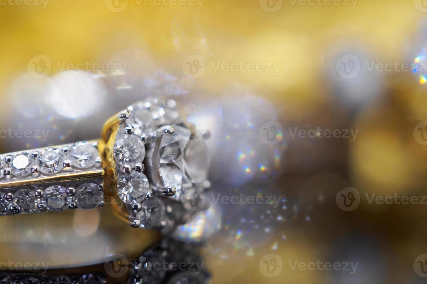 Luxury gold Jewelry diamond rings with reflection on black background photo