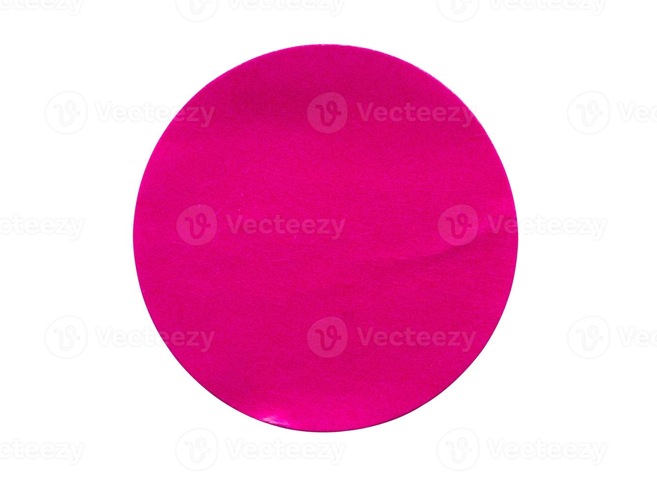 Blank pink round adhesive paper sticker label isolated on white background photo