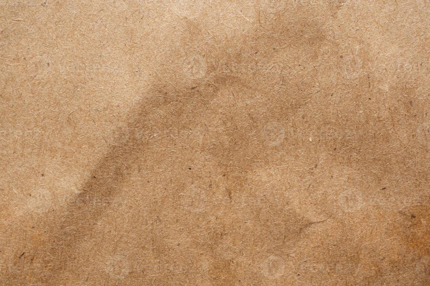 Brown crumpled paper recycled kraft sheet texture background photo