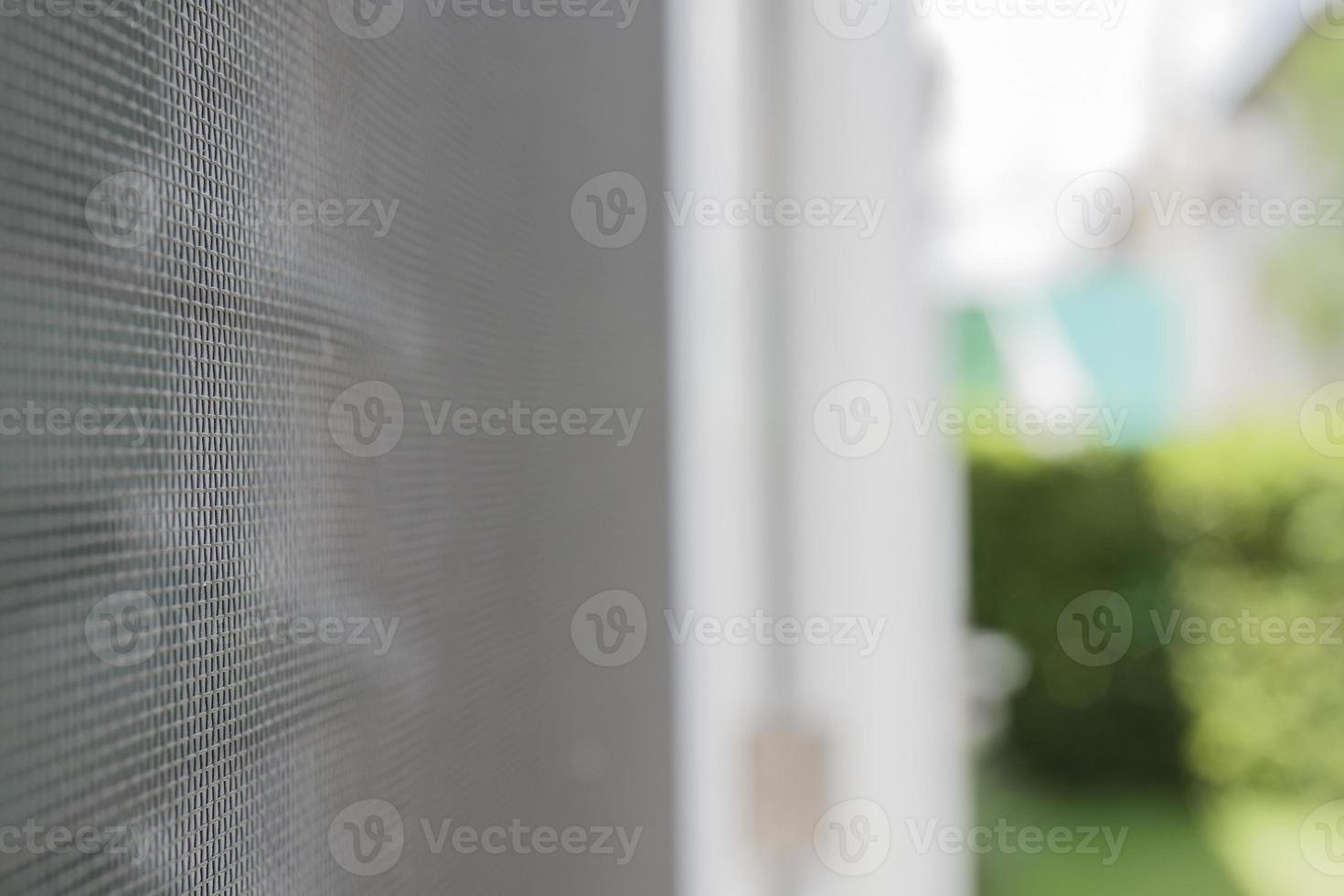 mosquito net wire screen on house window protection against insect photo