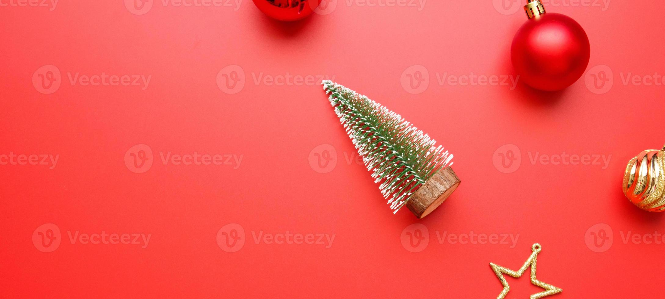 Christmas new year holiday background pine tree ball bauble on red background photo