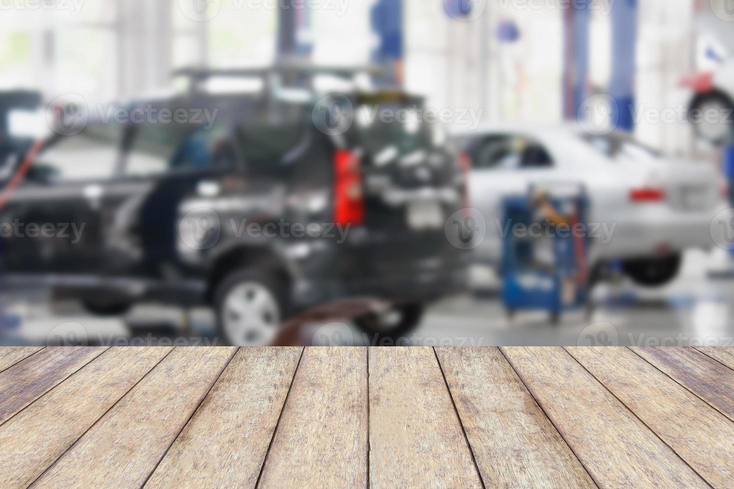 Wood table top with blur garage background photo