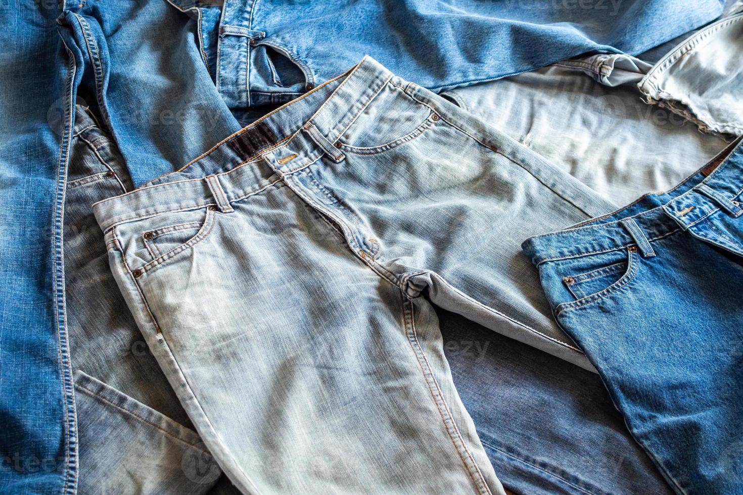 many denim blue jeans background photo