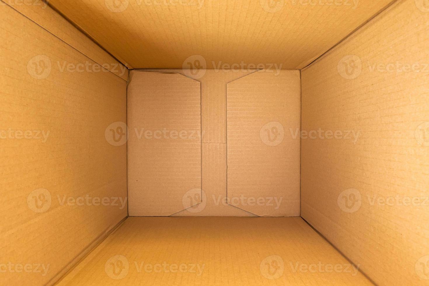 vista superior de fondo de caja de cartón marrón vacía abierta foto