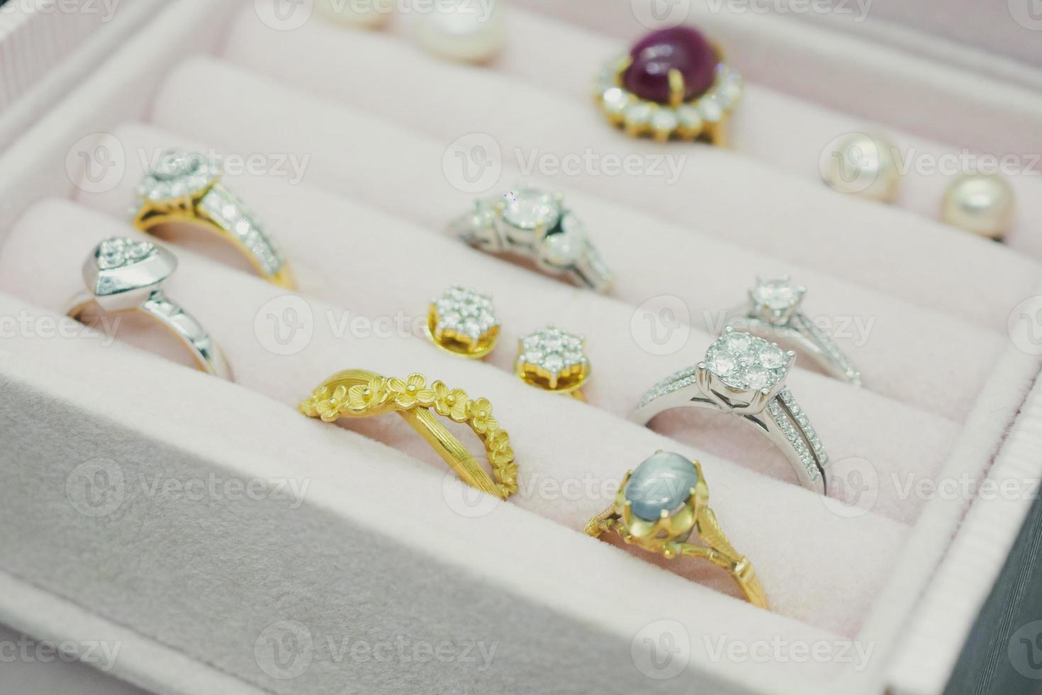 Gold and silver diamond gemstone ring and earrings in luxury jewelry box photo