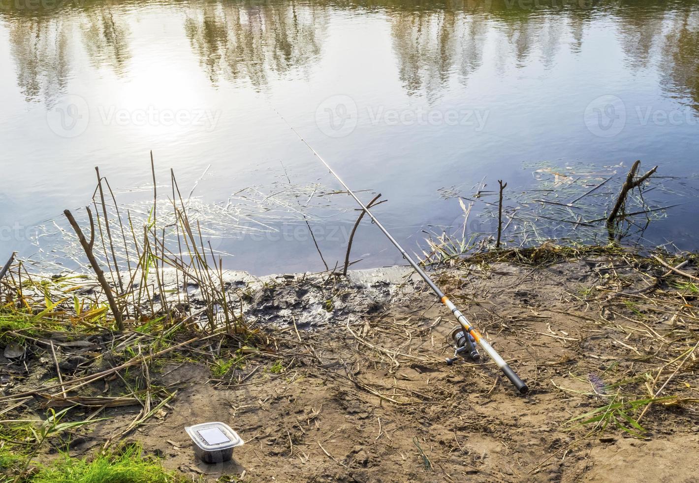Fishing rod on the water photo