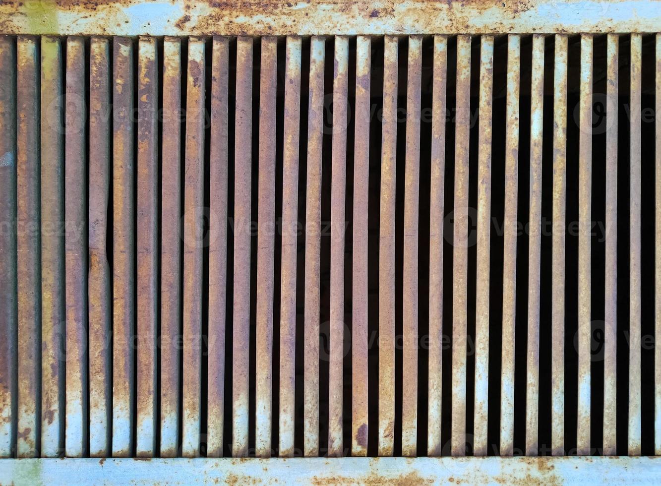 Old iron metal grill - rusty painted jalousie photo