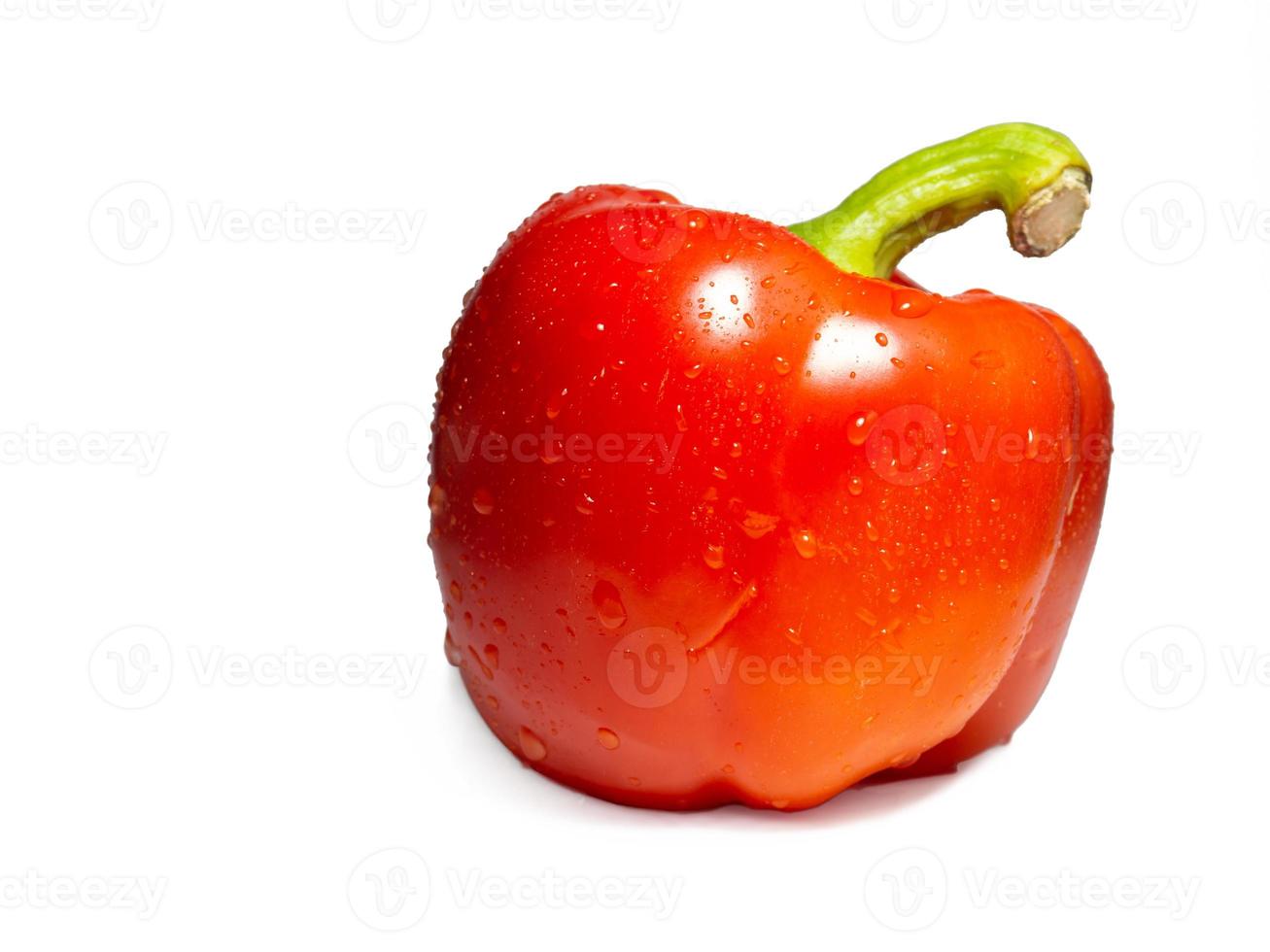 Red bell pepper on a white background. A healthy vegetable in droplets of water. photo