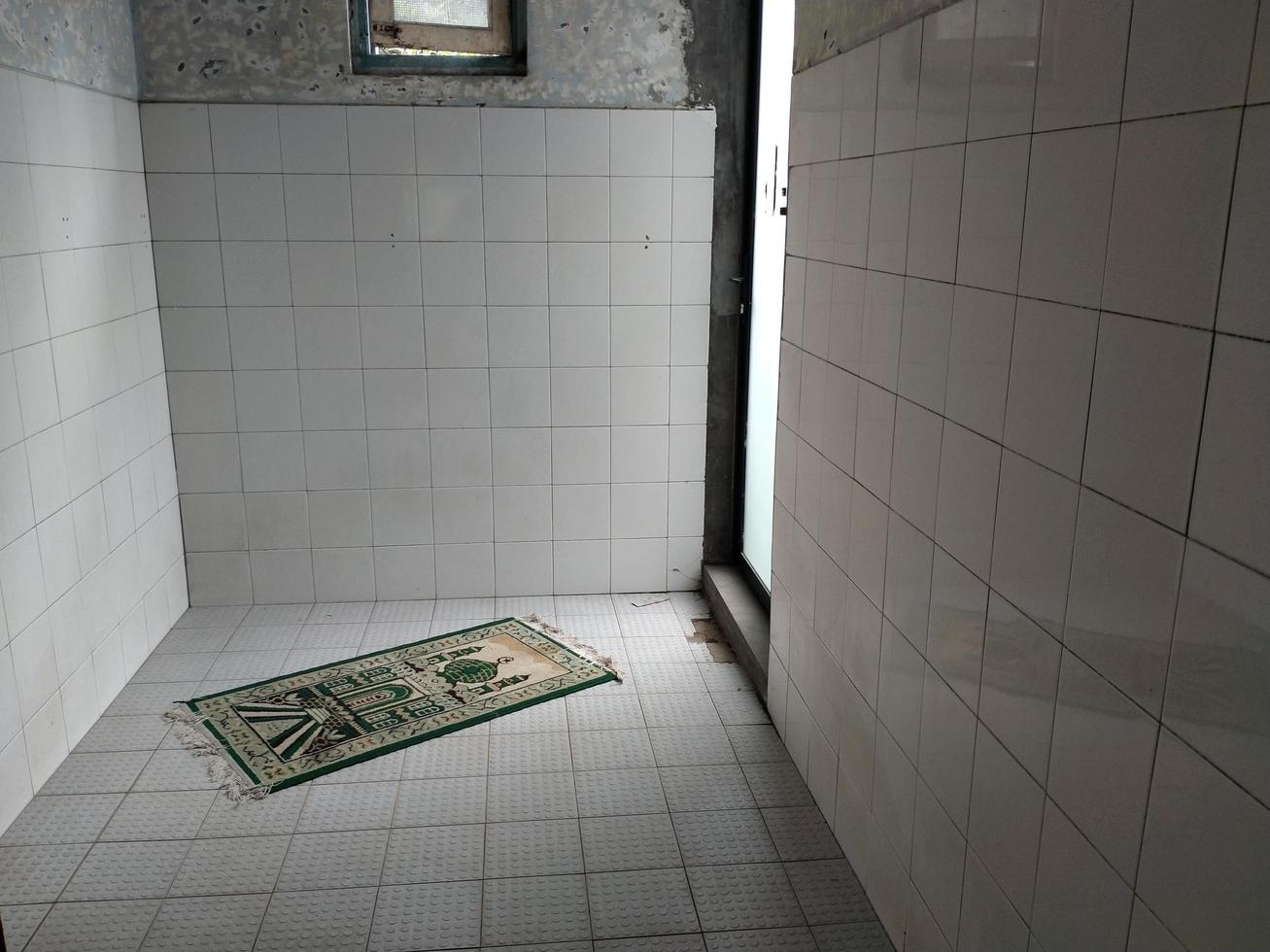 Muslim prayer room with sunlight coming in from the window photo