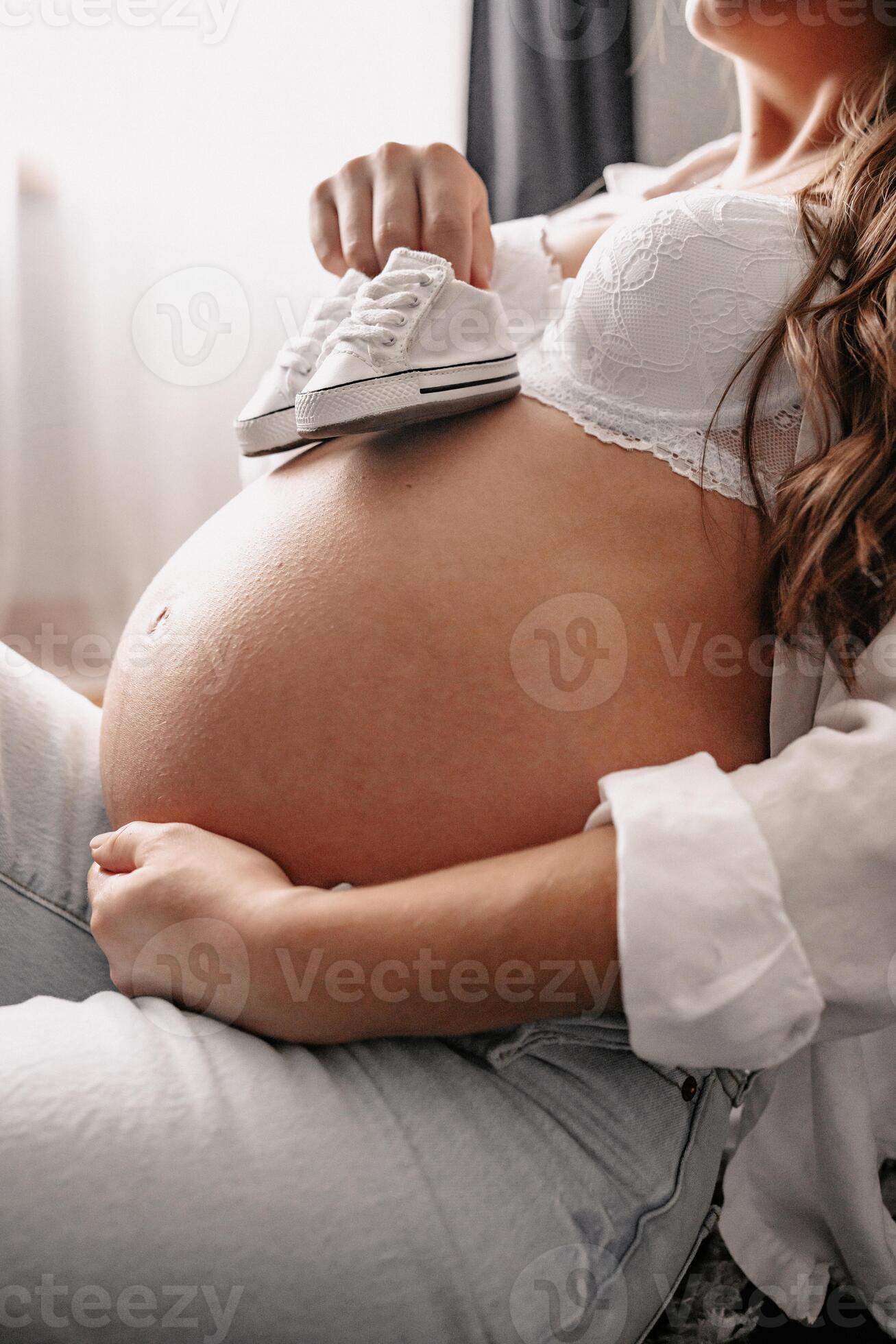 Pregnant Woman Caressing Her 8 Month Old Belly 12813438 Stock Photo At pregnant-woman-caressing-her-8-month-old-belly-12813438-stock-photo-at