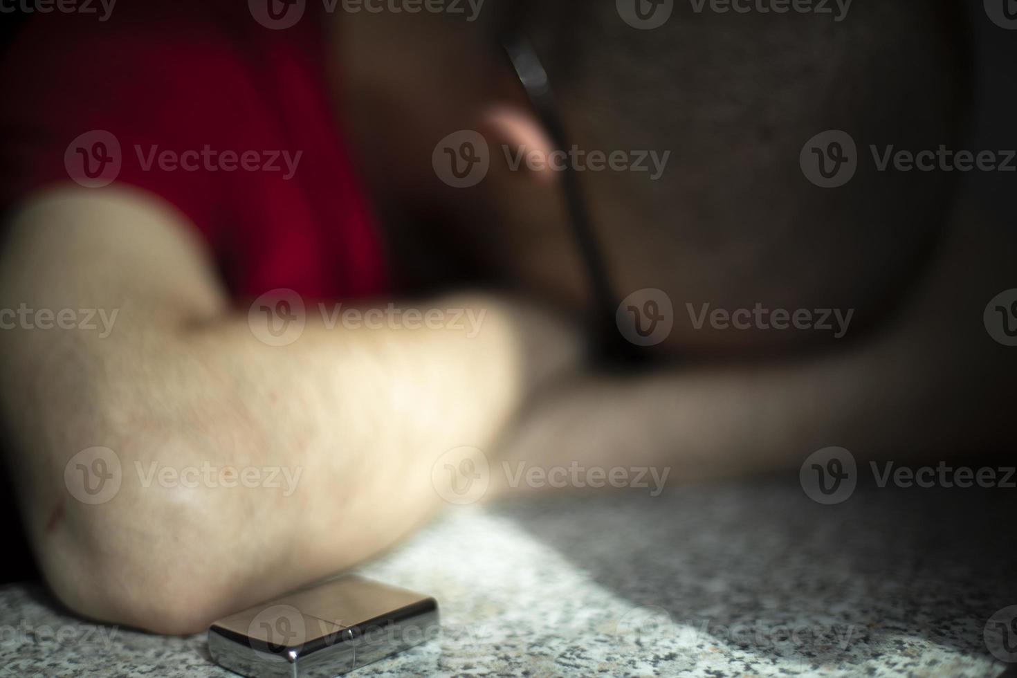 Guy sleeps from fatigue. Man fell asleep with his head on table. Lot of fatigue in body. photo
