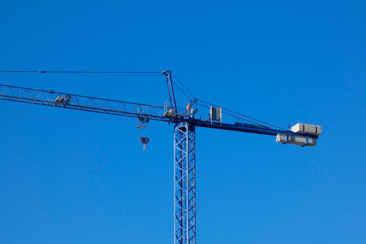 Cranes on a construction site of a building under construction photo