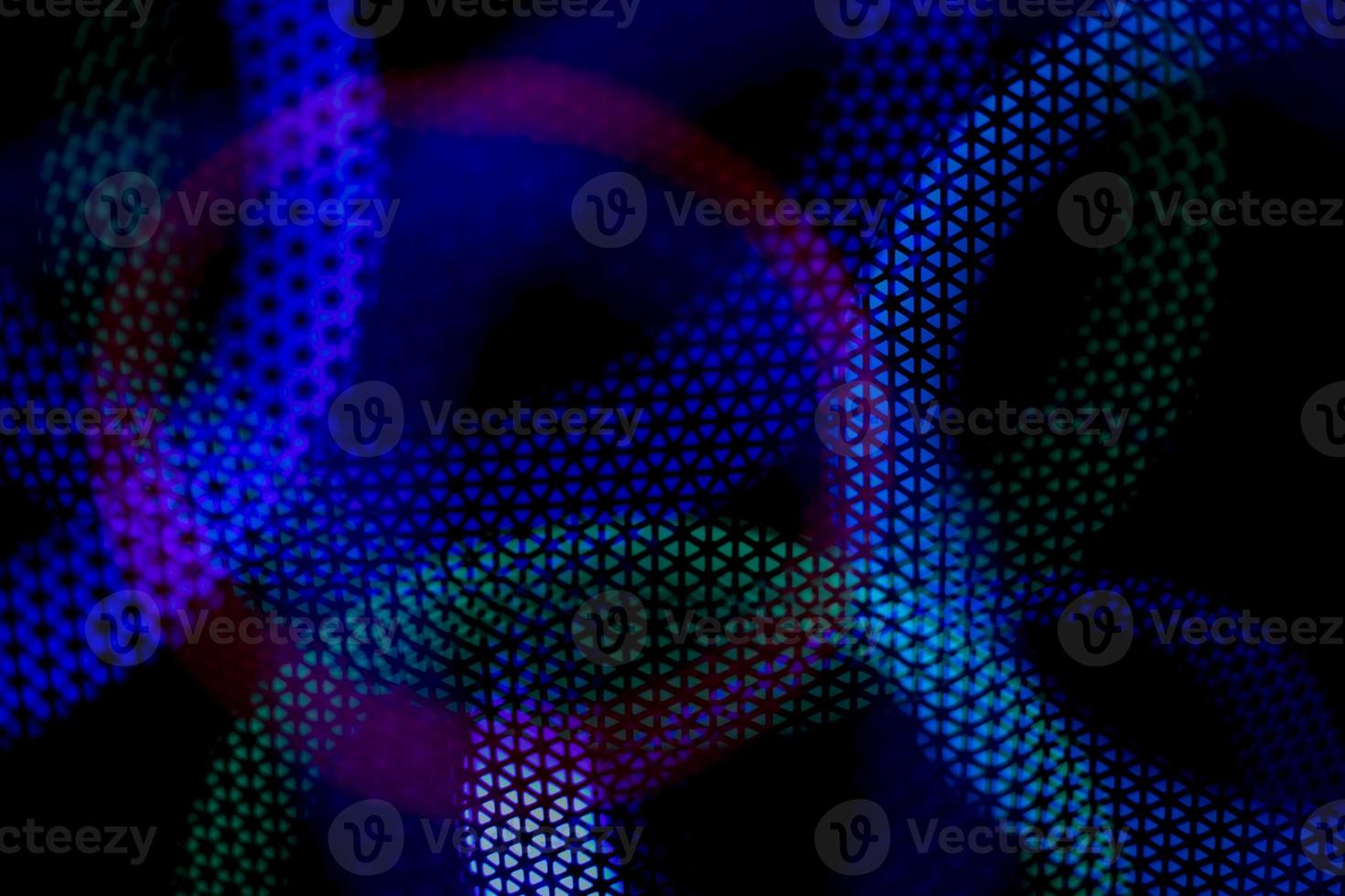 Color music. Abstract background glows in dark. Circles in net. photo