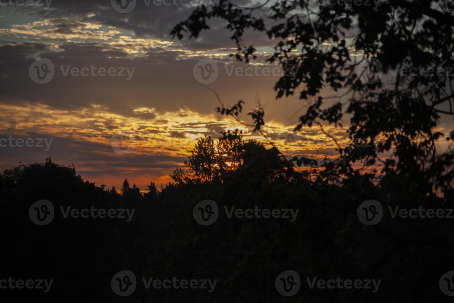 Sunset. Dawn in morning. Warm light in sky. Heavenly landscape in village. photo