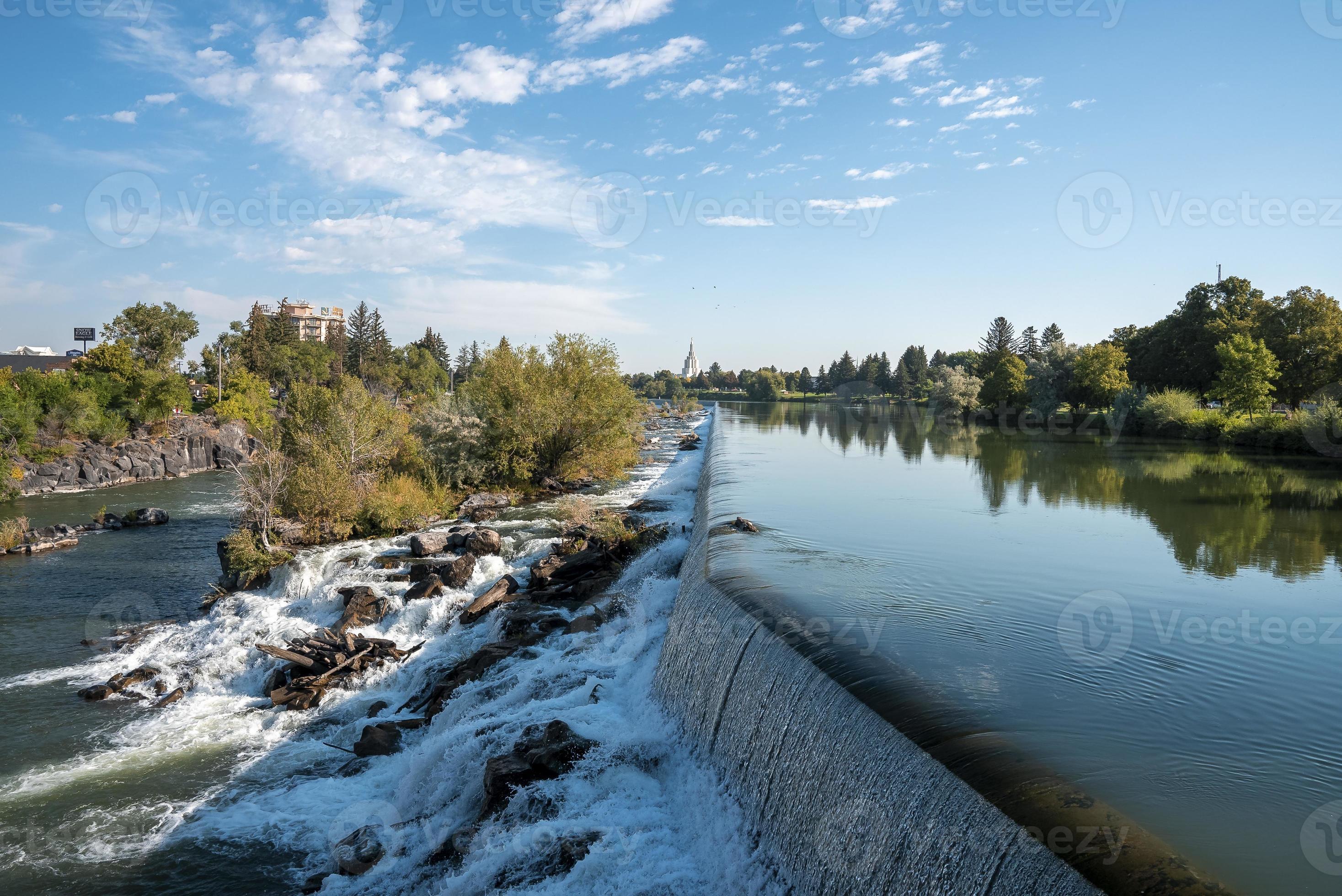Beautiful Idaho waterfall meeting snake river near temple with sky in