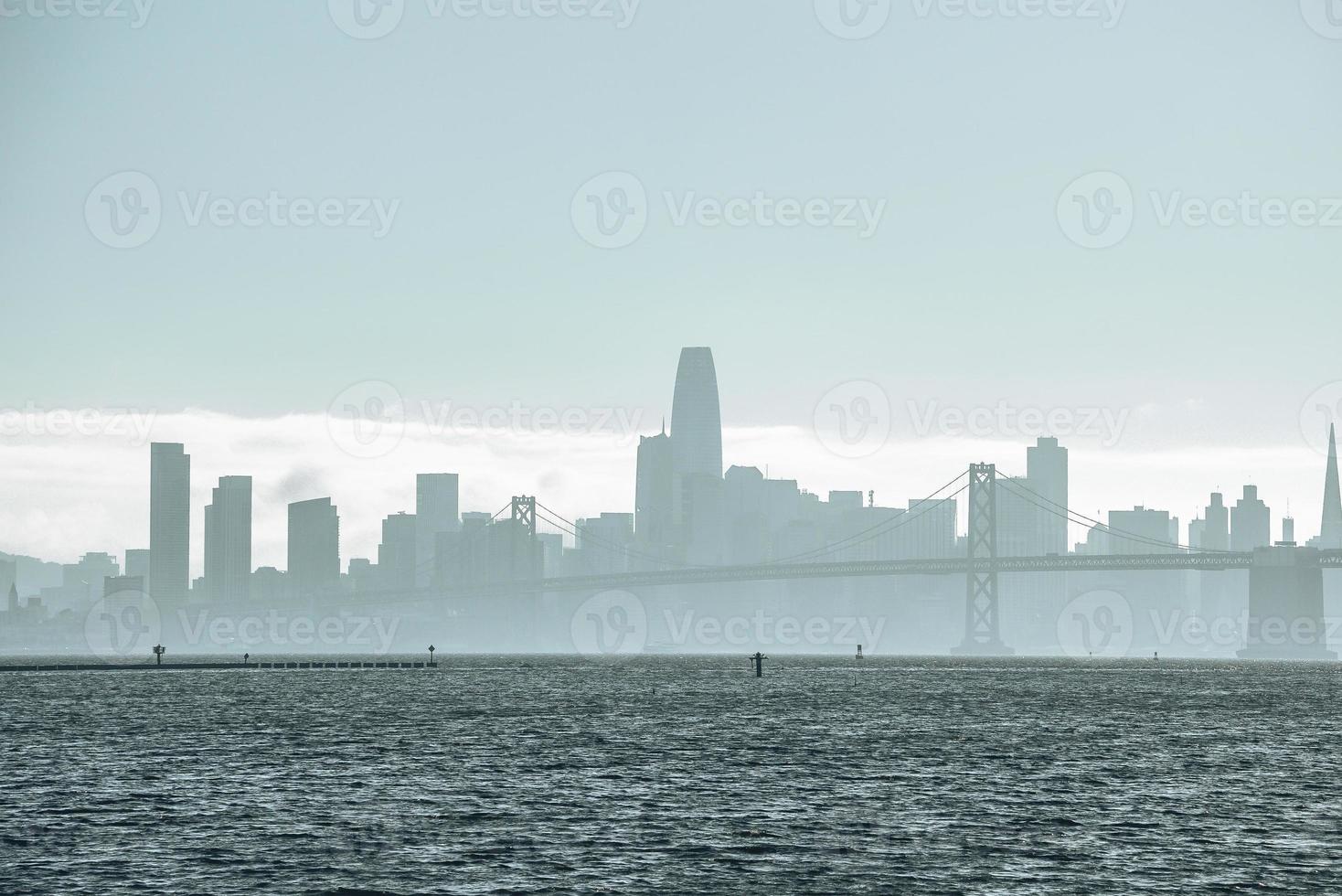Beautiful view of Bay Bridge and skyline with clear sky in background photo
