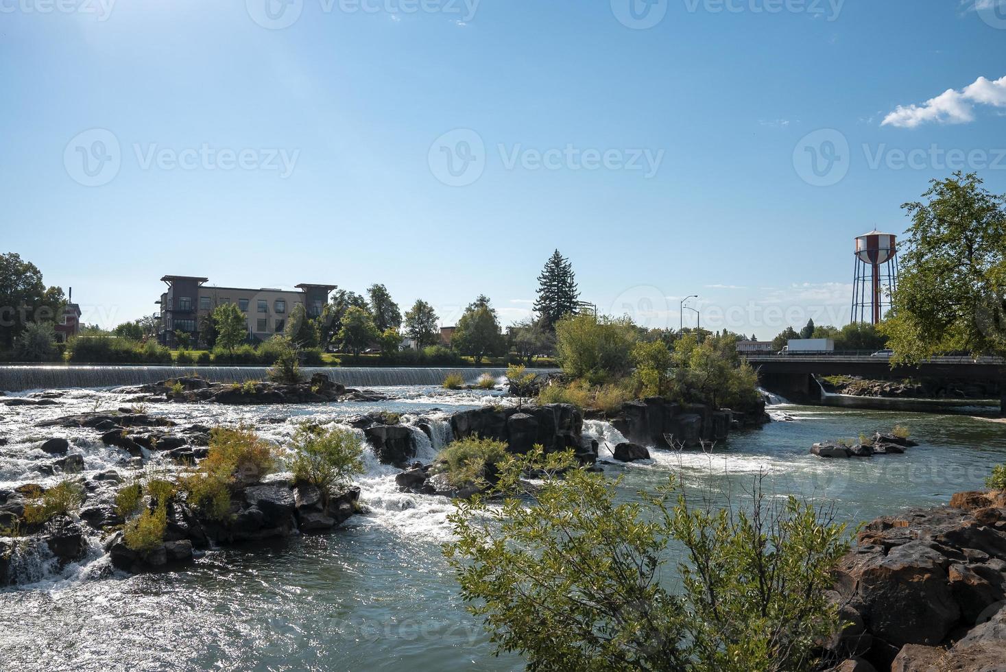 Beautiful snake river at Idaho falls flowing by museum with sky in background photo