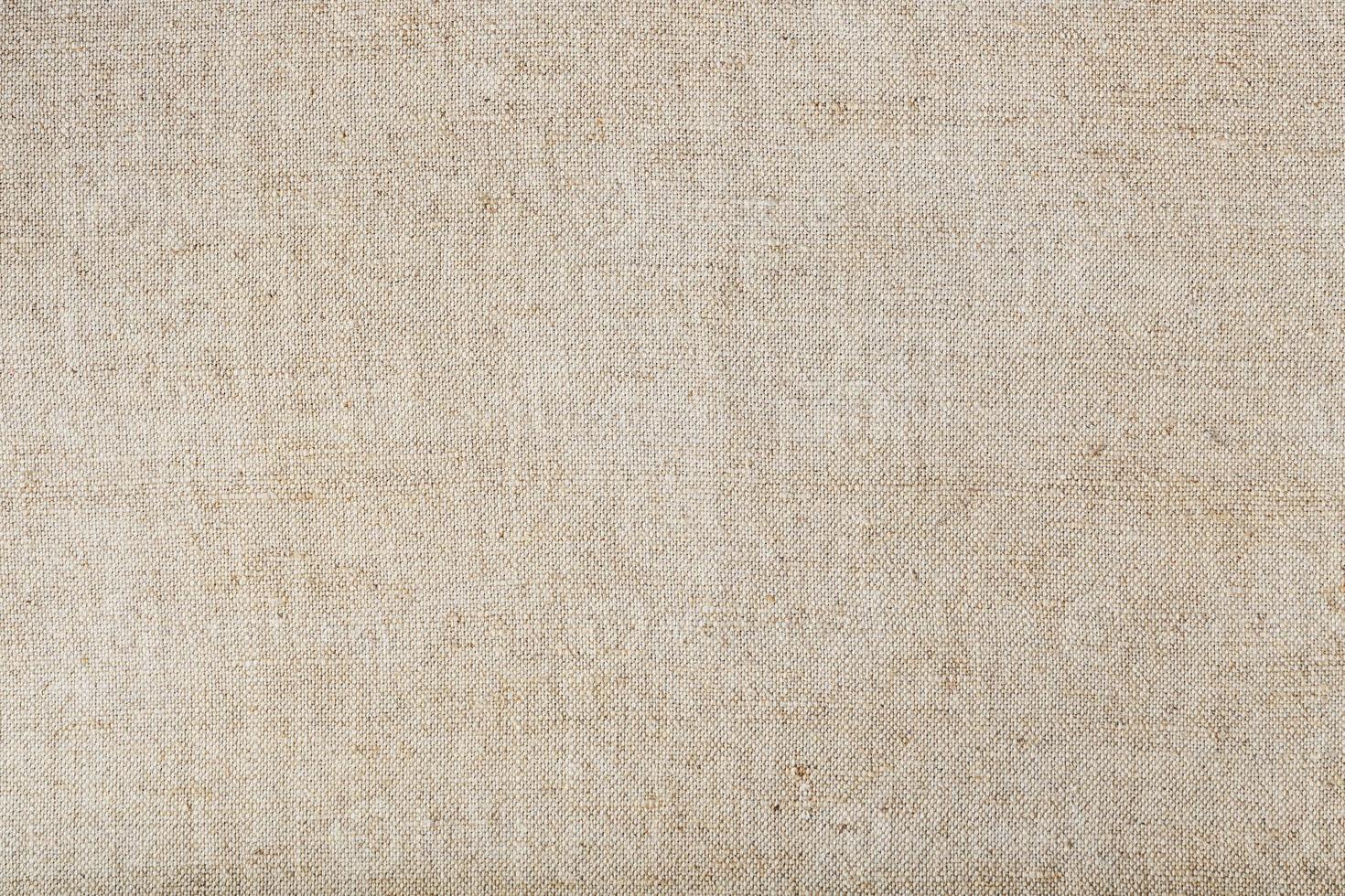 Natural burlap fabric with fibers as background. photo