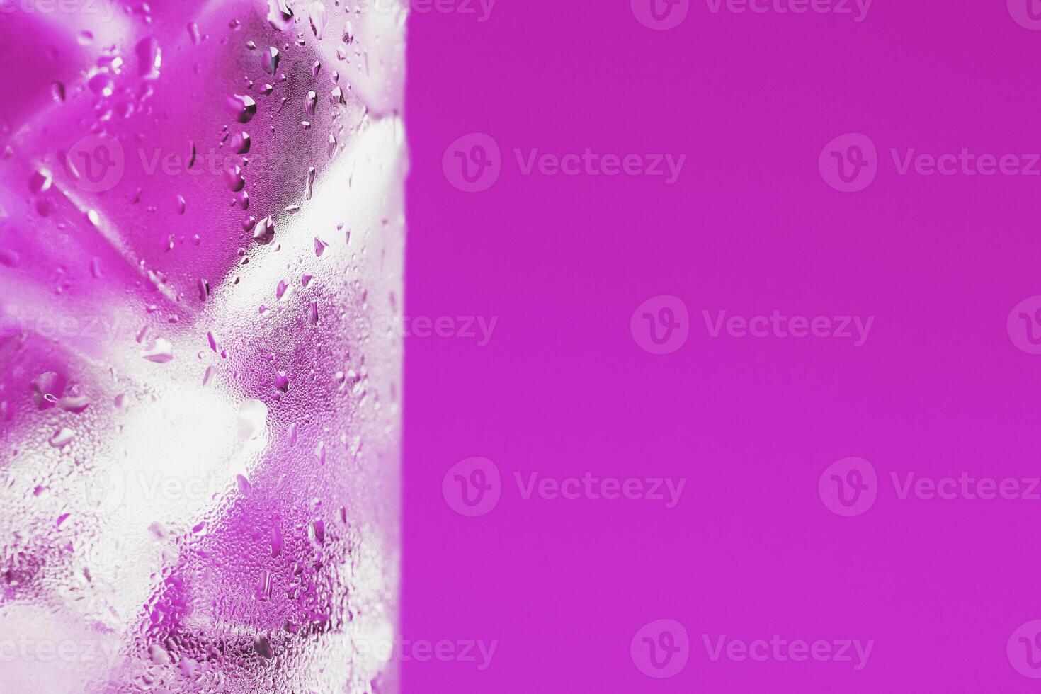 A glass with ice water and ice cubes on a blue background. 12822246