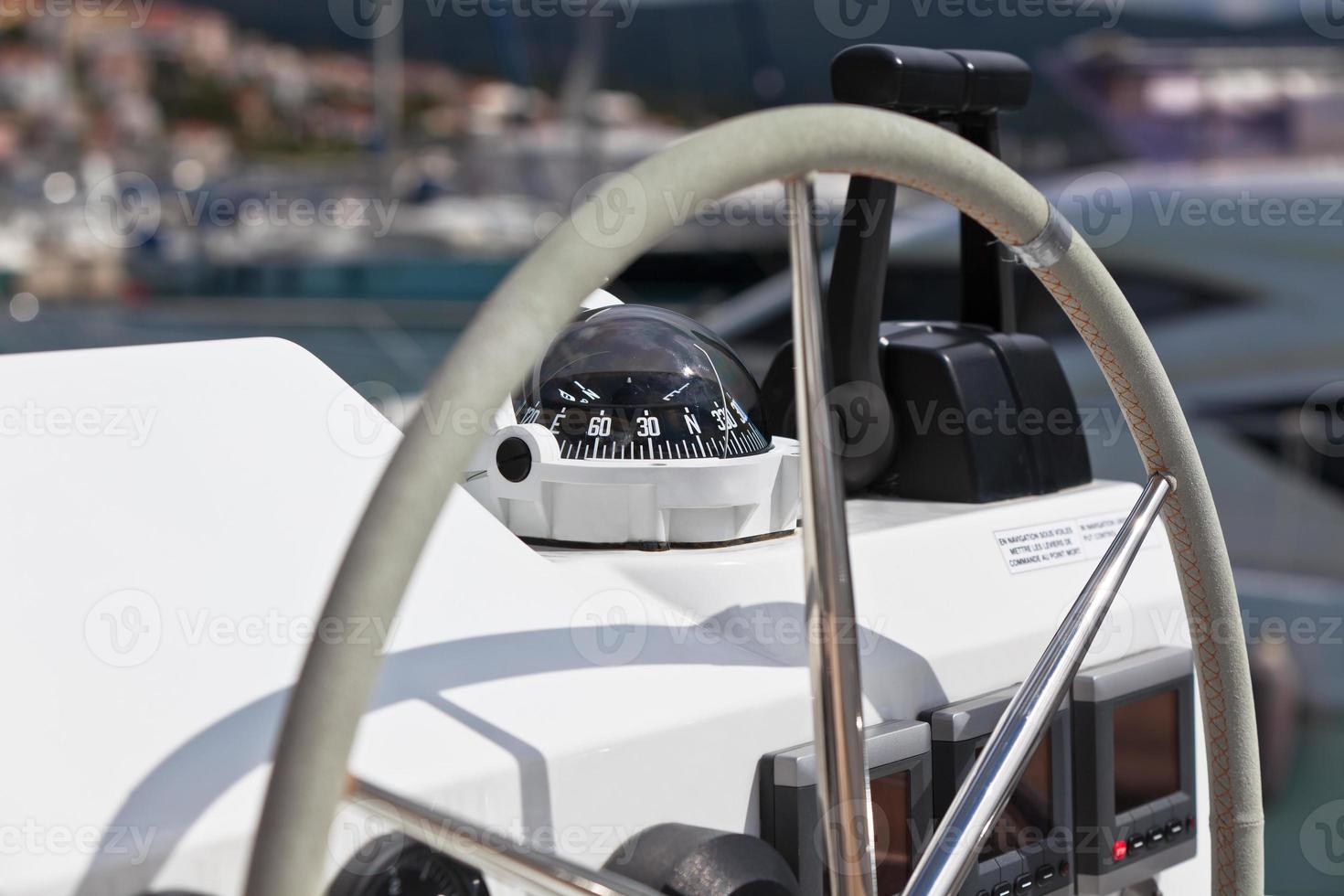 Sailing yacht control wheel and implement. photo