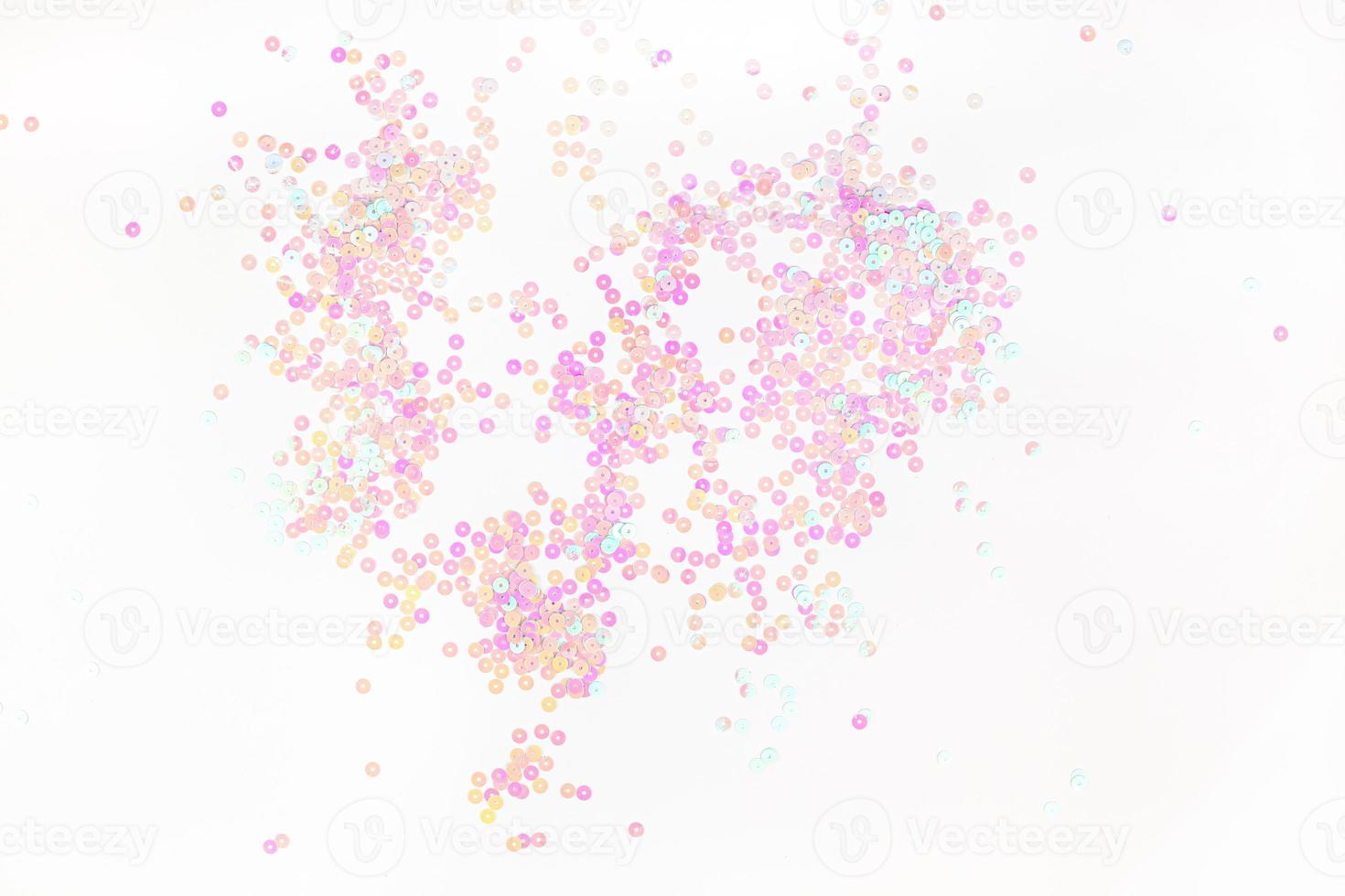 Pearl pastel confetti sparkles on white background photo