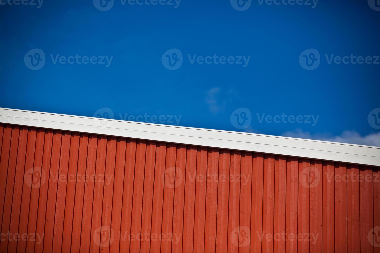 Geometrical shot of house wall on sky background photo