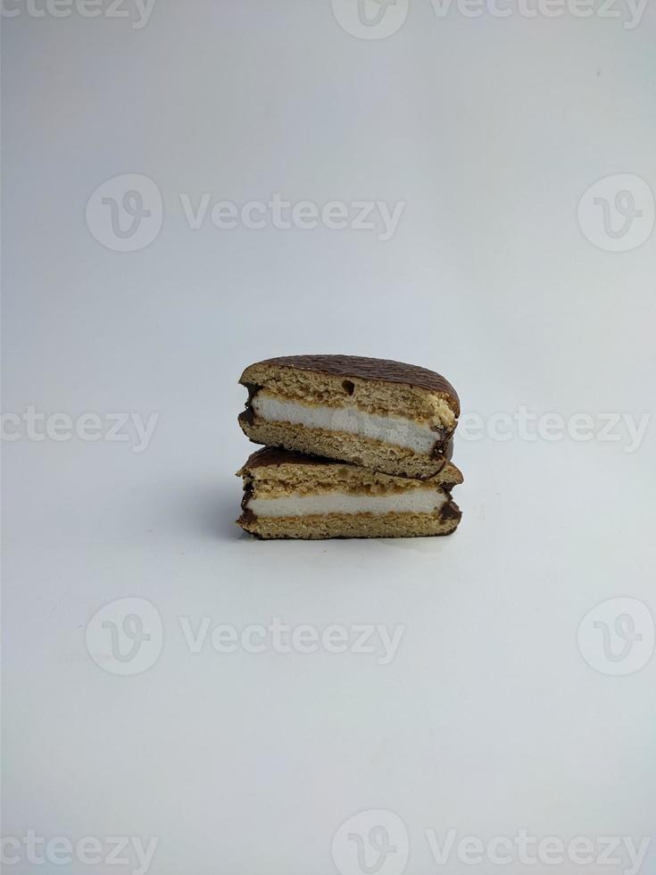 Delicious choco pies with marshmallow on white background. Classic snack cakes photo