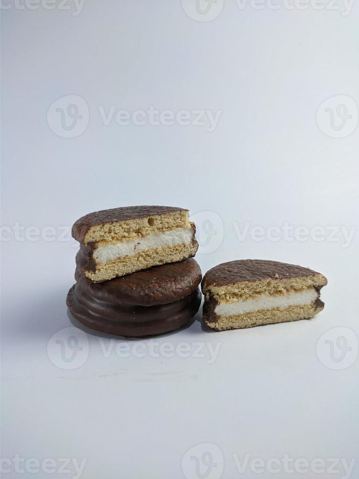 Delicious choco pies with marshmallow on white background. Classic snack cakes photo