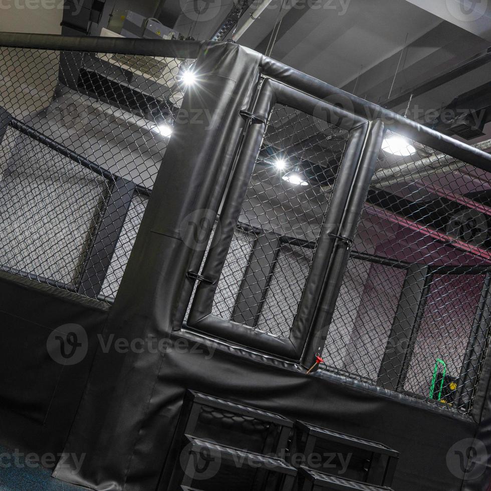 An octagonal kickboxing cage in the sports complex photo
