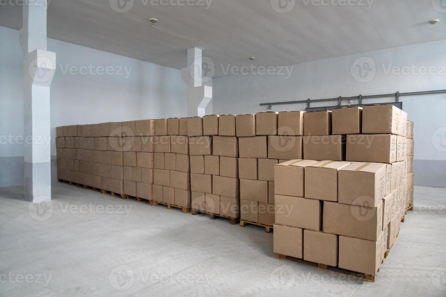 A pile of craft boxes stacked on top of each other in a white warehouse photo