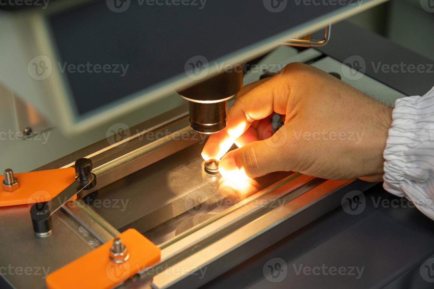 A closeup of the production and quality control of the internal parts of medical syringes photo