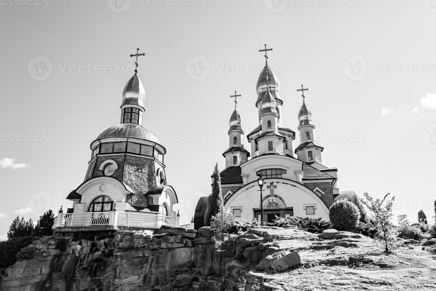 Christian church cross in high steeple tower for prayer photo