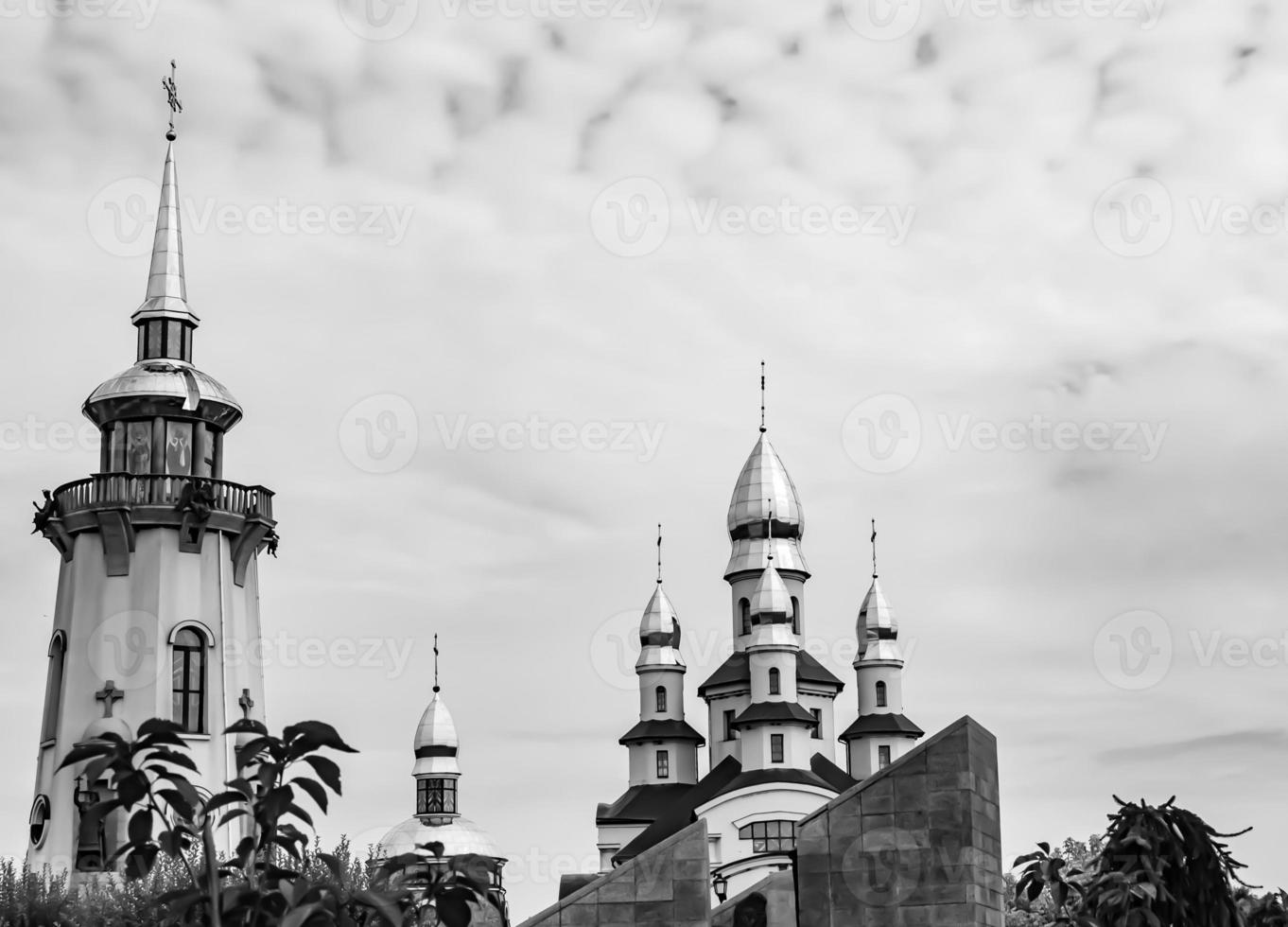 Christian church cross in high steeple tower for prayer photo