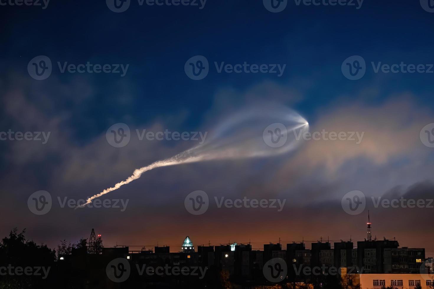 Soyuz space rocket launch. Space jellyfish in sky. Plume of rocket gases in sun at dawn. photo
