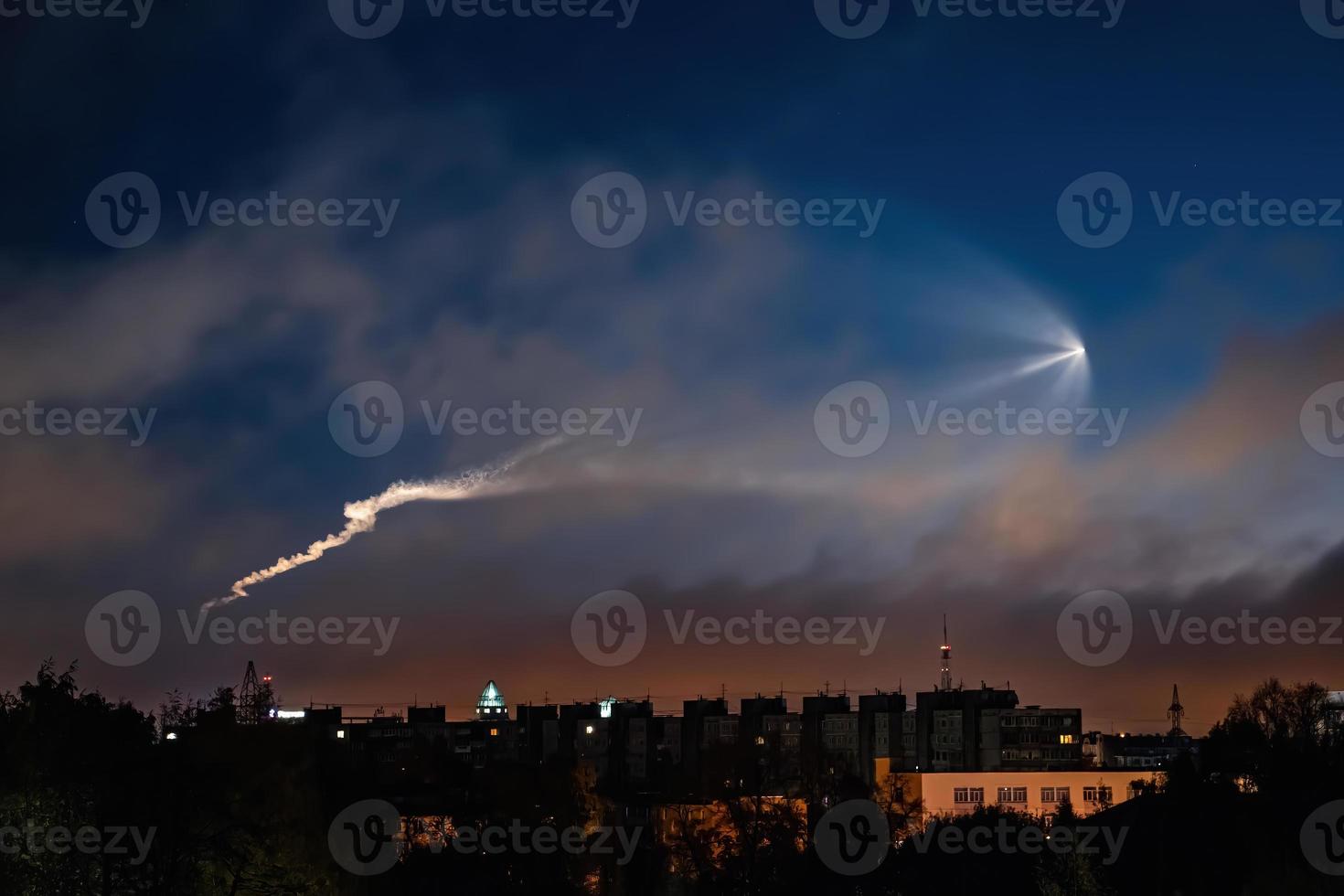 Soyuz space rocket launch. Space jellyfish in sky. Plume of rocket gases in sun at dawn. photo