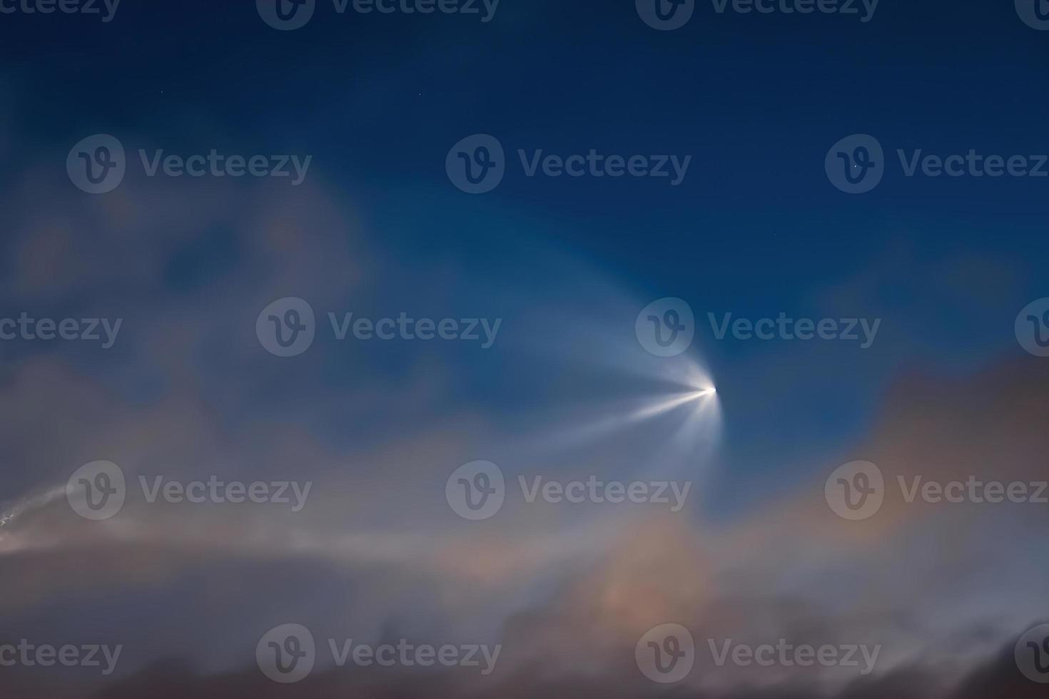 Soyuz space rocket launch. Space jellyfish in sky. Plume of rocket gases in sun at dawn. photo