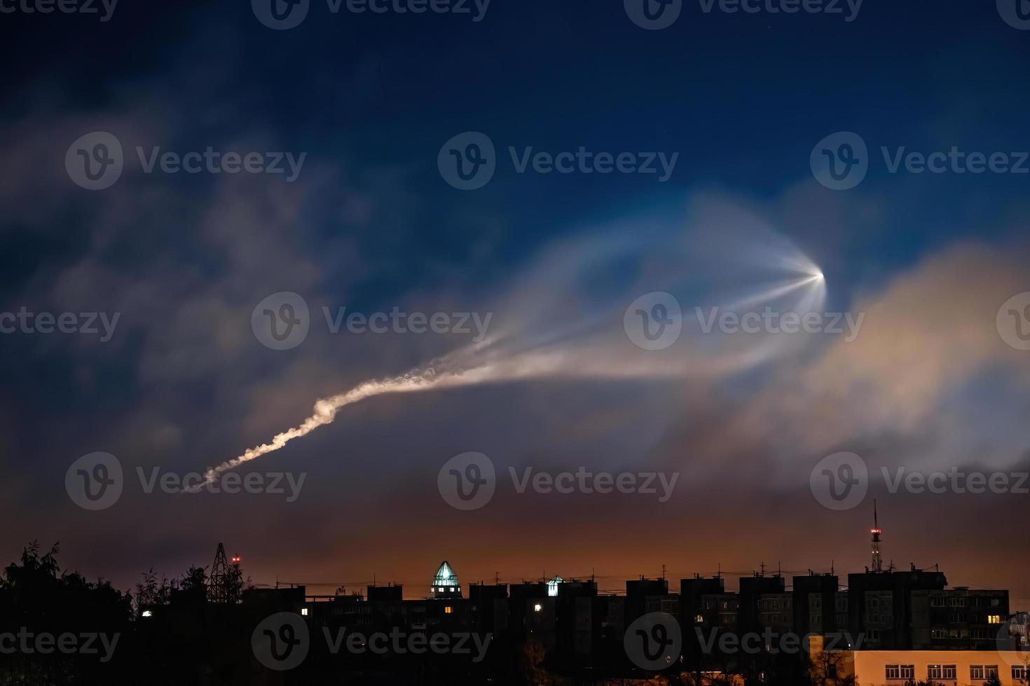 Soyuz space rocket launch. Space jellyfish in sky. Plume of rocket gases in sun at dawn. photo