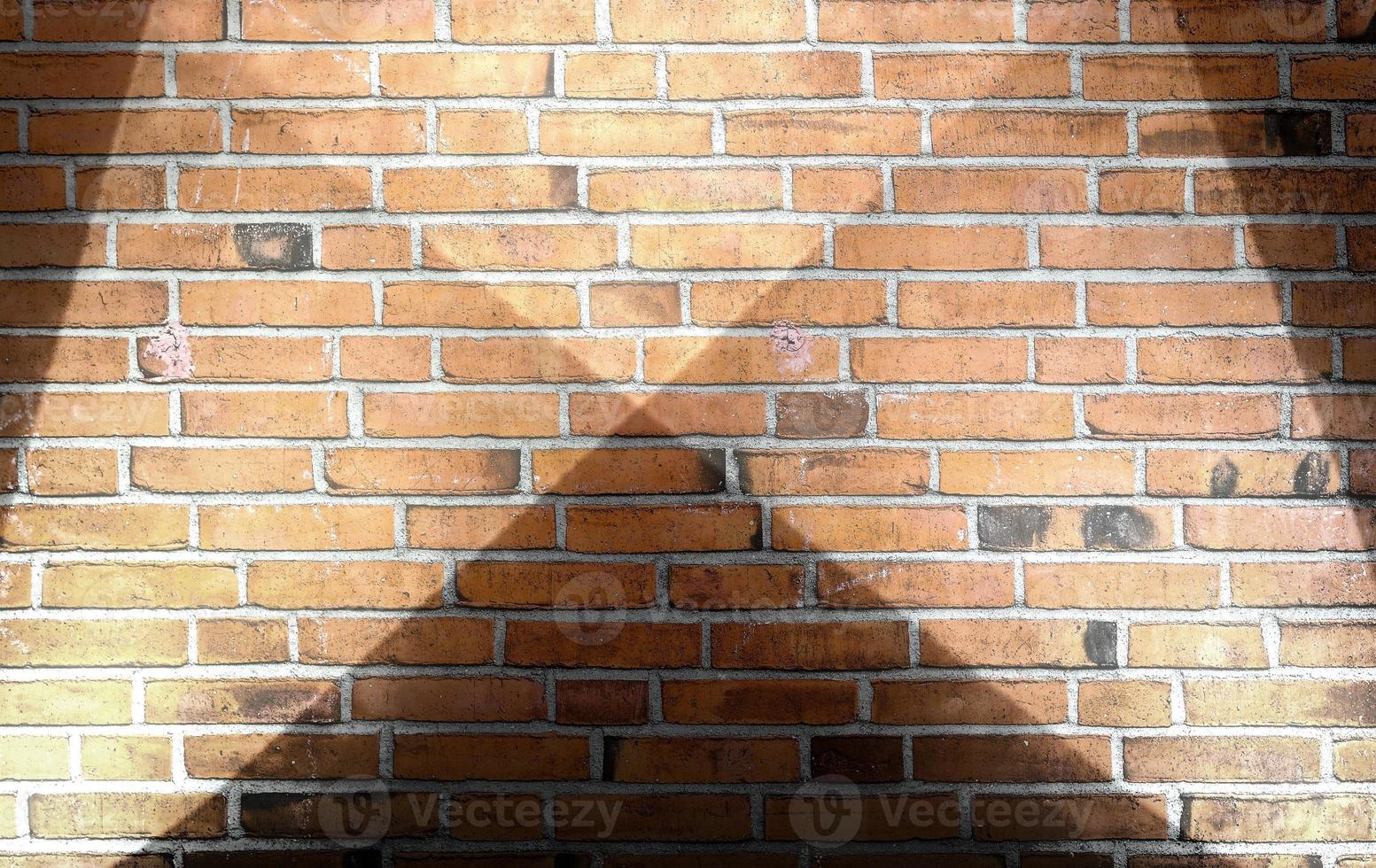 Aged and weathered brick wall textures with very bright spotlight illumination photo
