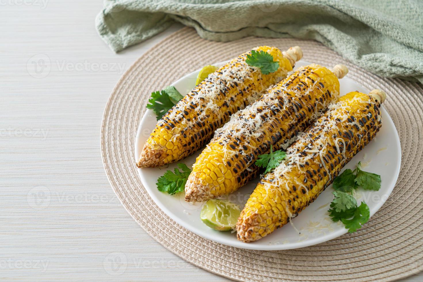 barbecue and grilled corn with cheese and lime photo