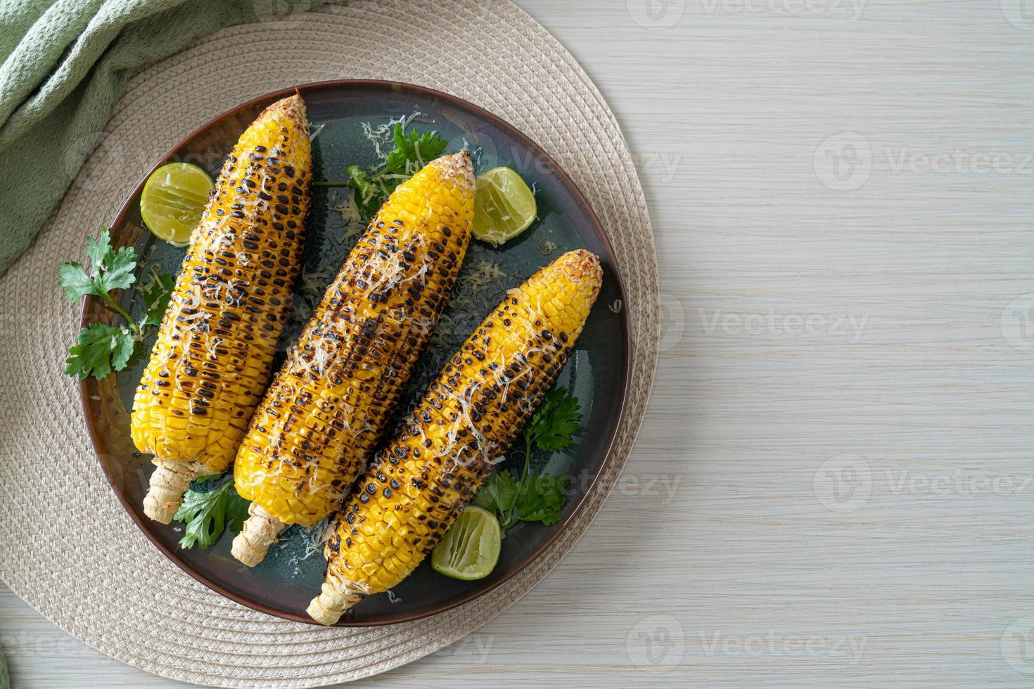 barbecue and grilled corn with cheese and lime photo