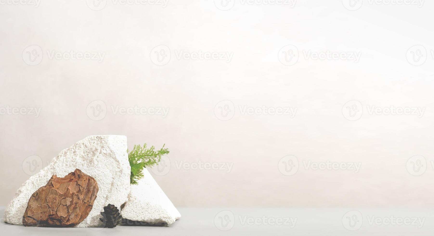 Empty table top with natural stones, tree bark and grass. copy space, template for product presentation photo