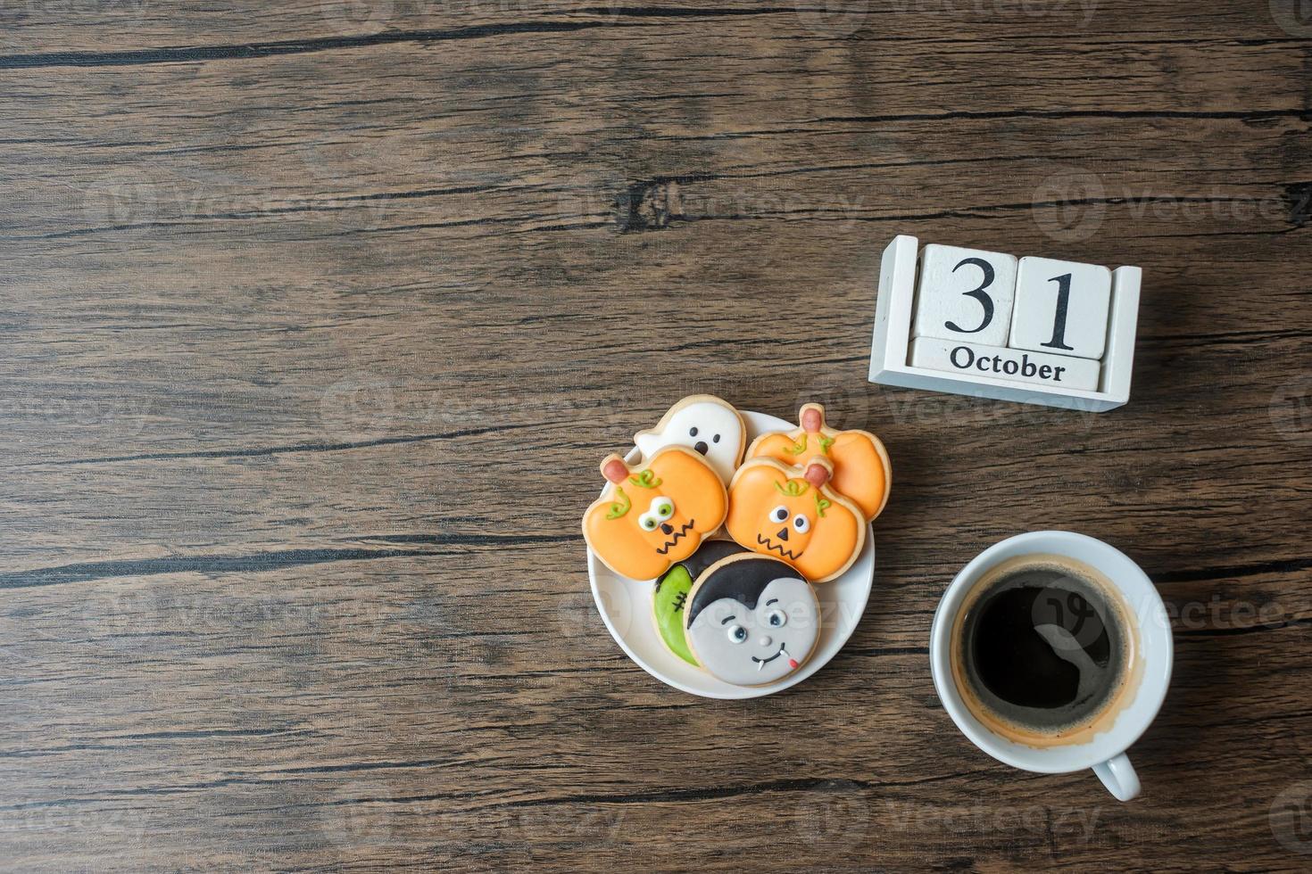 Happy Halloween day with cookies, coffee and 31 October calendar on white background. Trick or Threat, Hello October, fall autumn, Festive, party and holiday concept photo